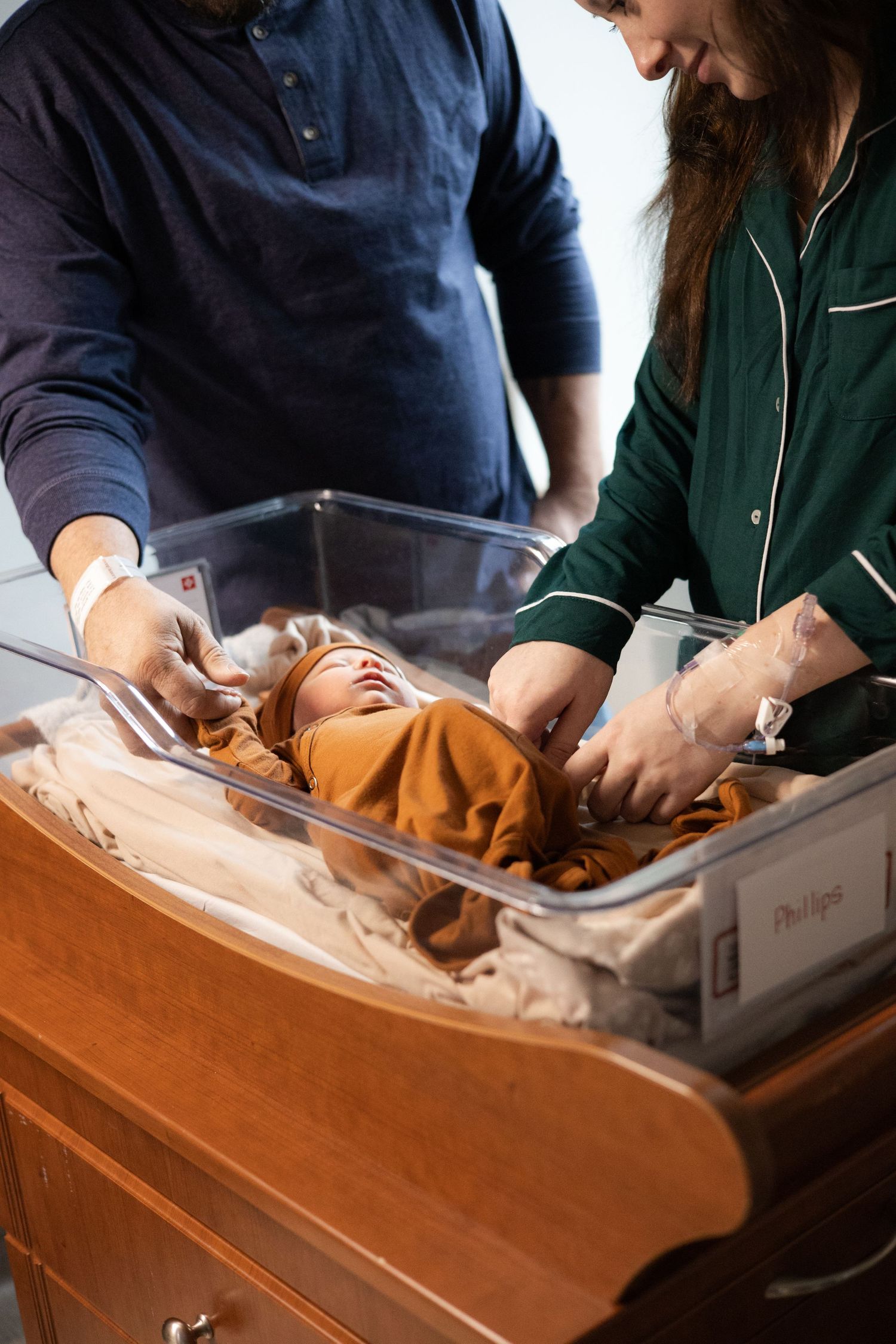 Central Illinois photographer captures a family soaking in a newborn during a Fresh 48 photo session in a hospital in Springfield, IL