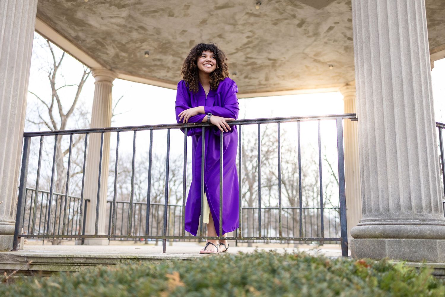 Central Illinois photographer captures a senior in a cap and gown during a graduation senior session in Springfield, IL