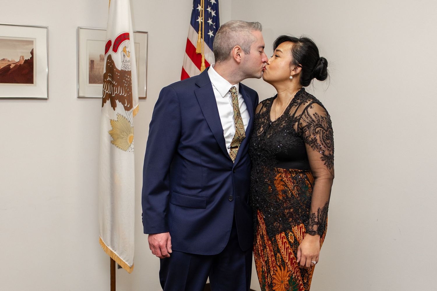 Central Illinois photographer captures a couple kissing after getting married during a wedding session in Springfield, IL