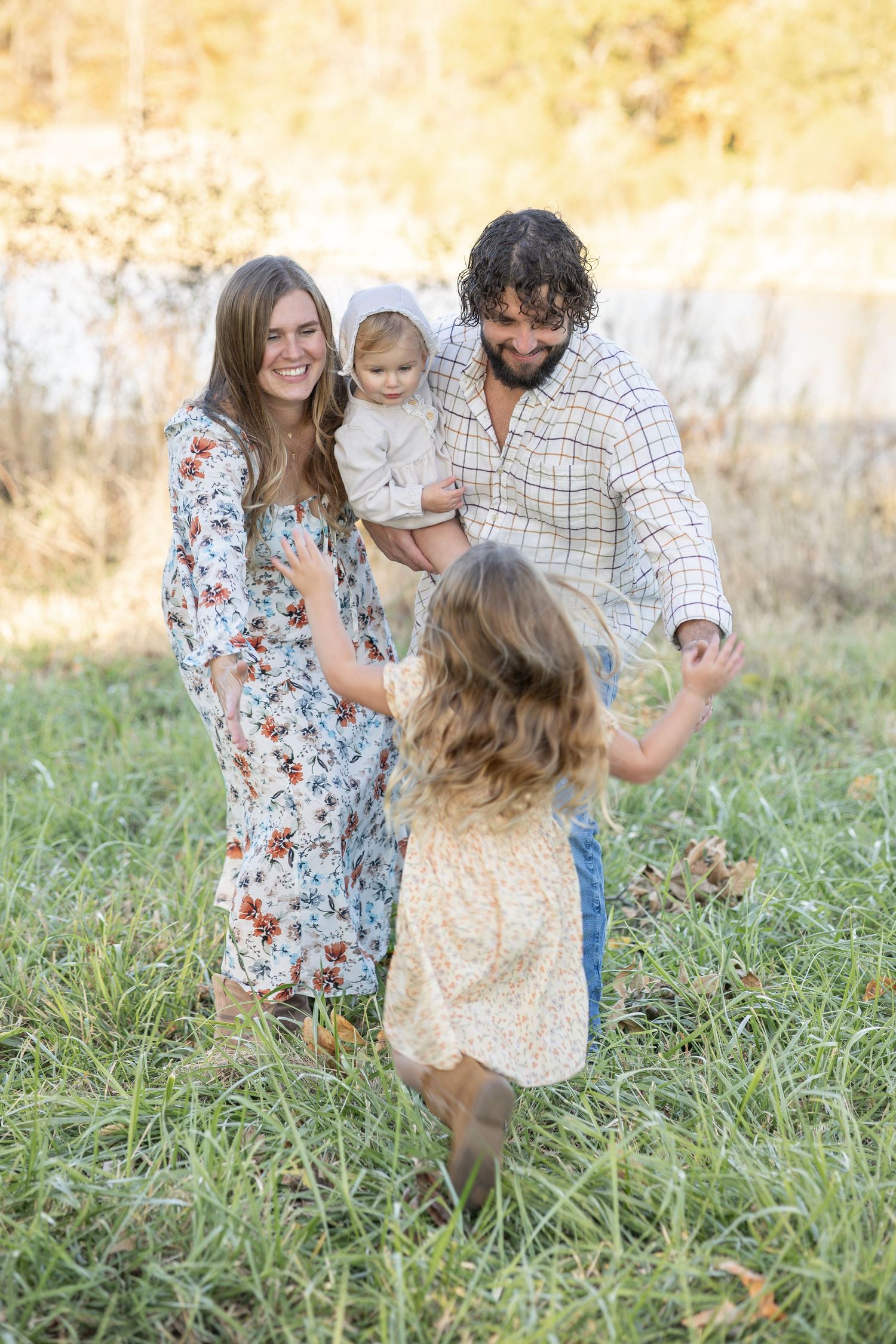 Central Illinois photographer captures a family playing together during a family photo session in Decatur, IL