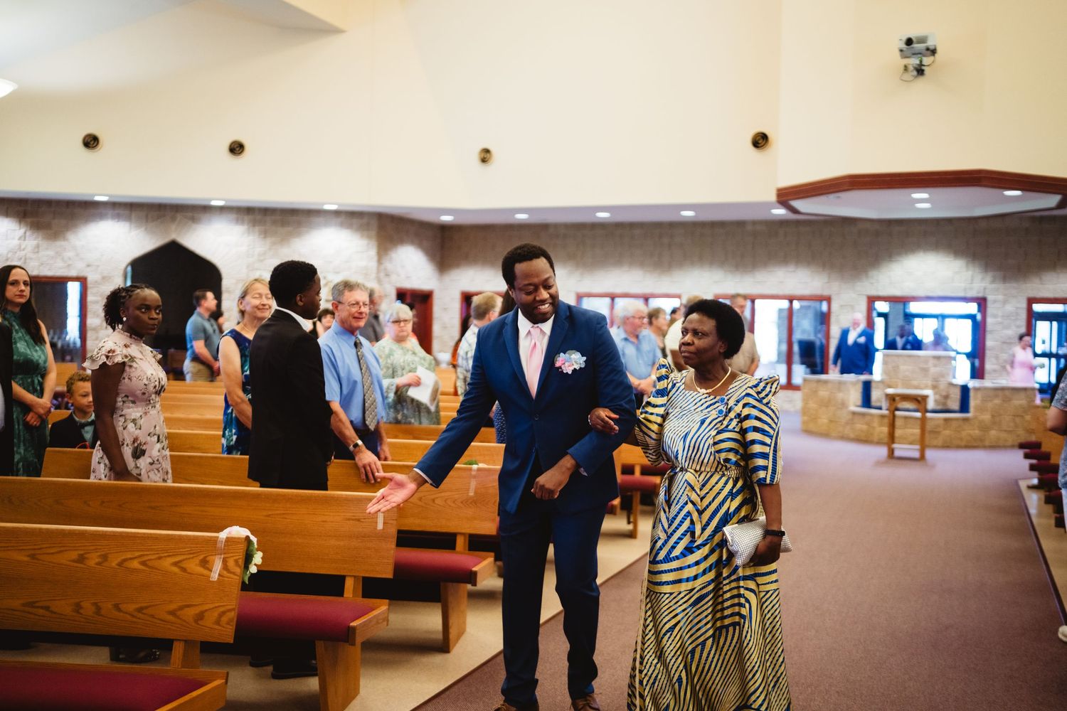 Multiple frames showing attendees and pews from an indoor church wedding ceremony and reception.