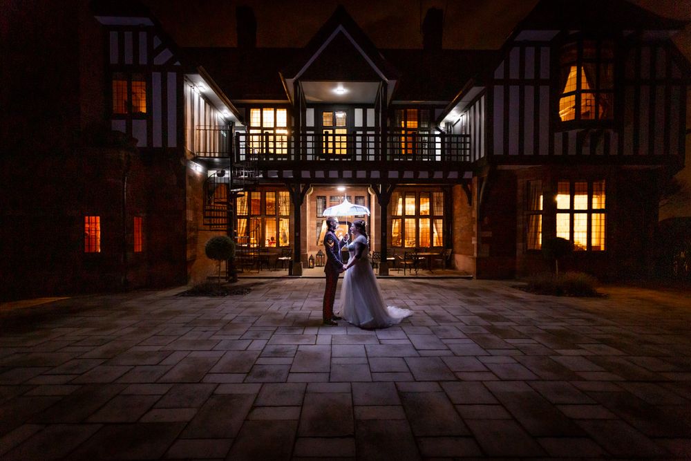 Night time couple wedding portrait outside Inglewood Manor, Cheshire. Colourful Wedding Photography. Cheshire Wedding Photographer
