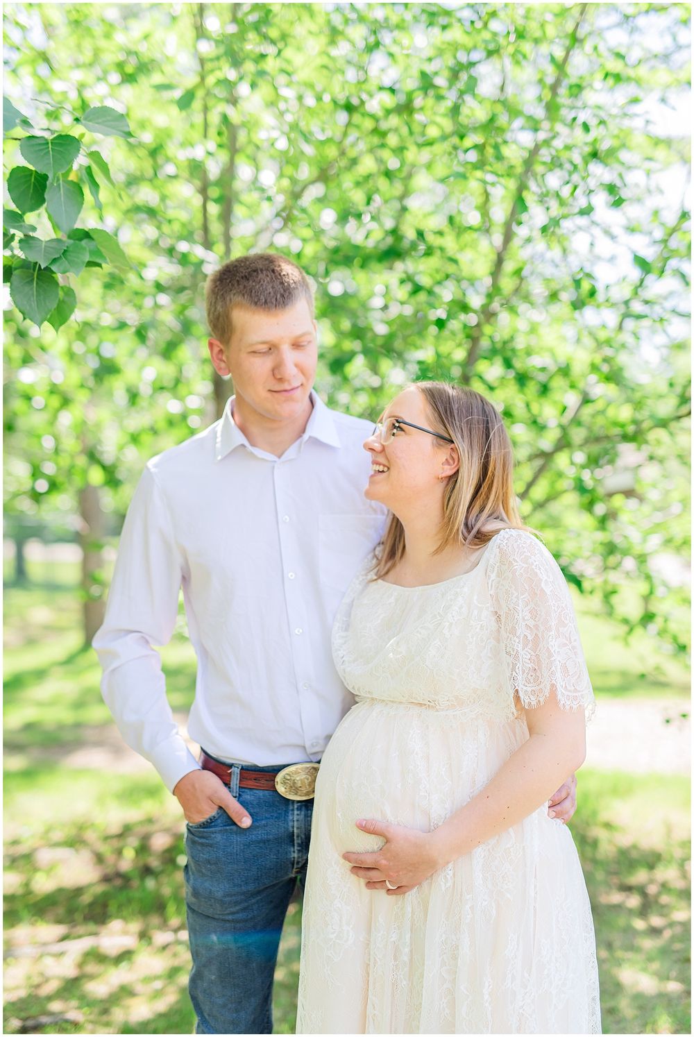 A sweet moment captured between a couple during their spring maternity photoshoot.
