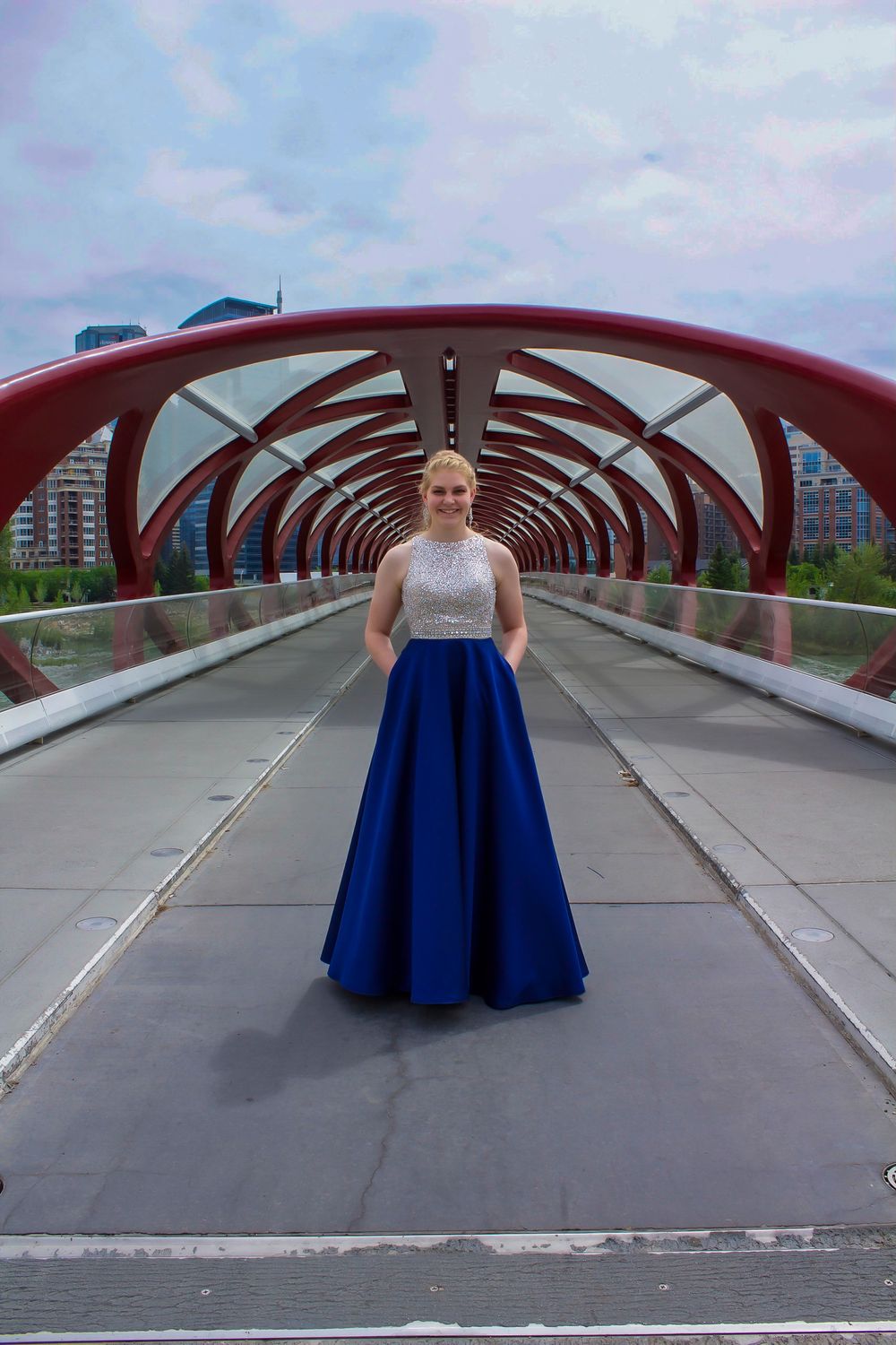 a grad on a bridge over a river.