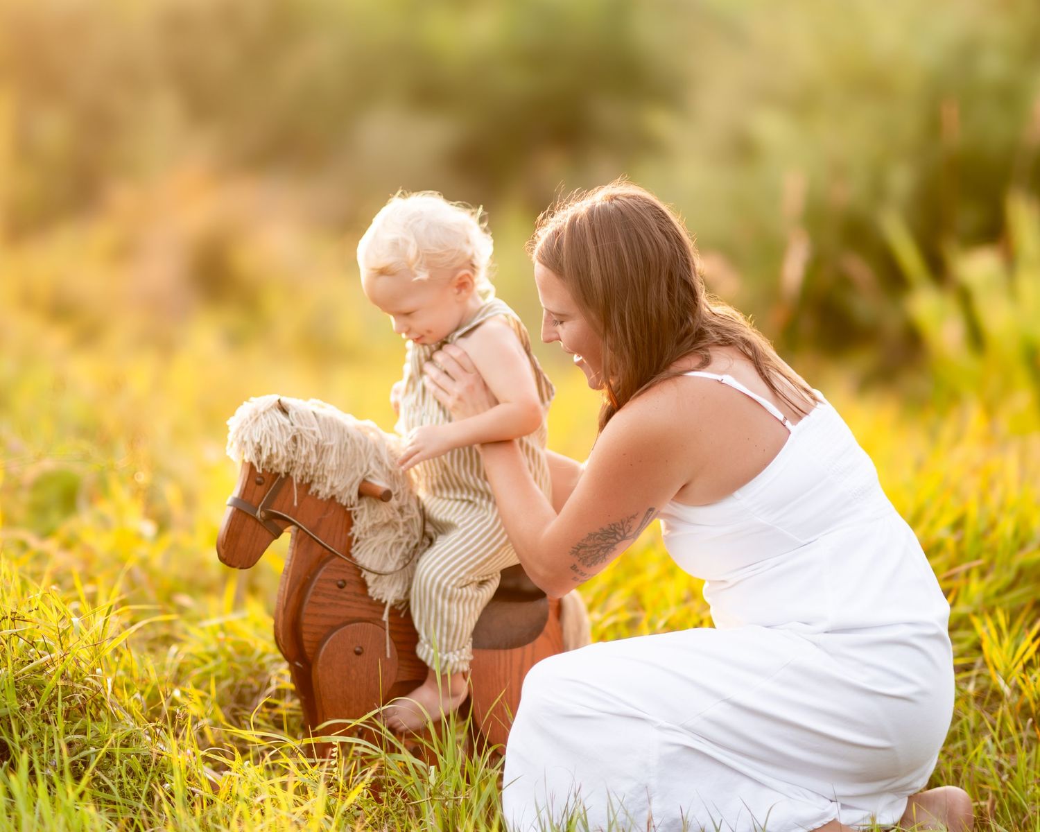 A rocking horse brings joy to a heartwarming scene in a sunlit field with wildflowers and golden light.