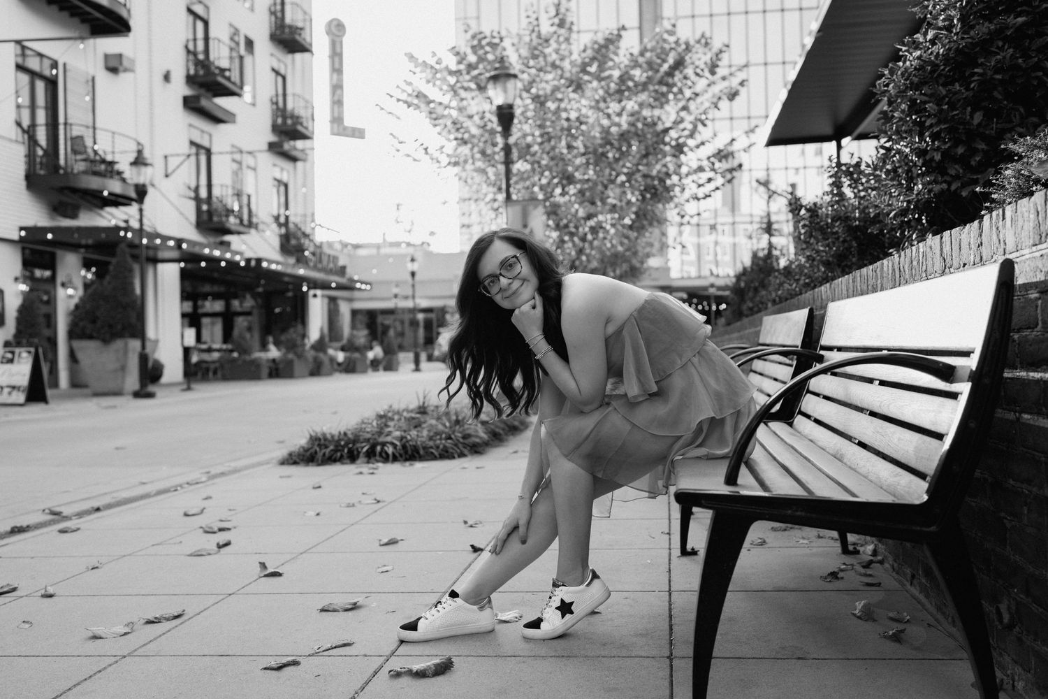A sequence of black and white photos capturing dance movements on a city street. Chattanooga Senior Photographer