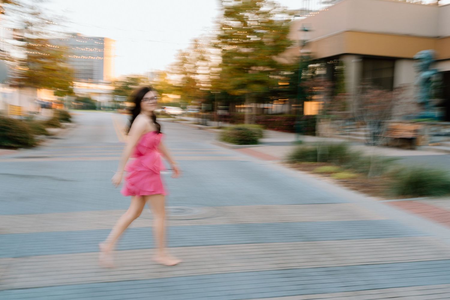 Dynamic motion shots showing movement in a pink dress along a curved path. Chattanooga Senior Photographer
