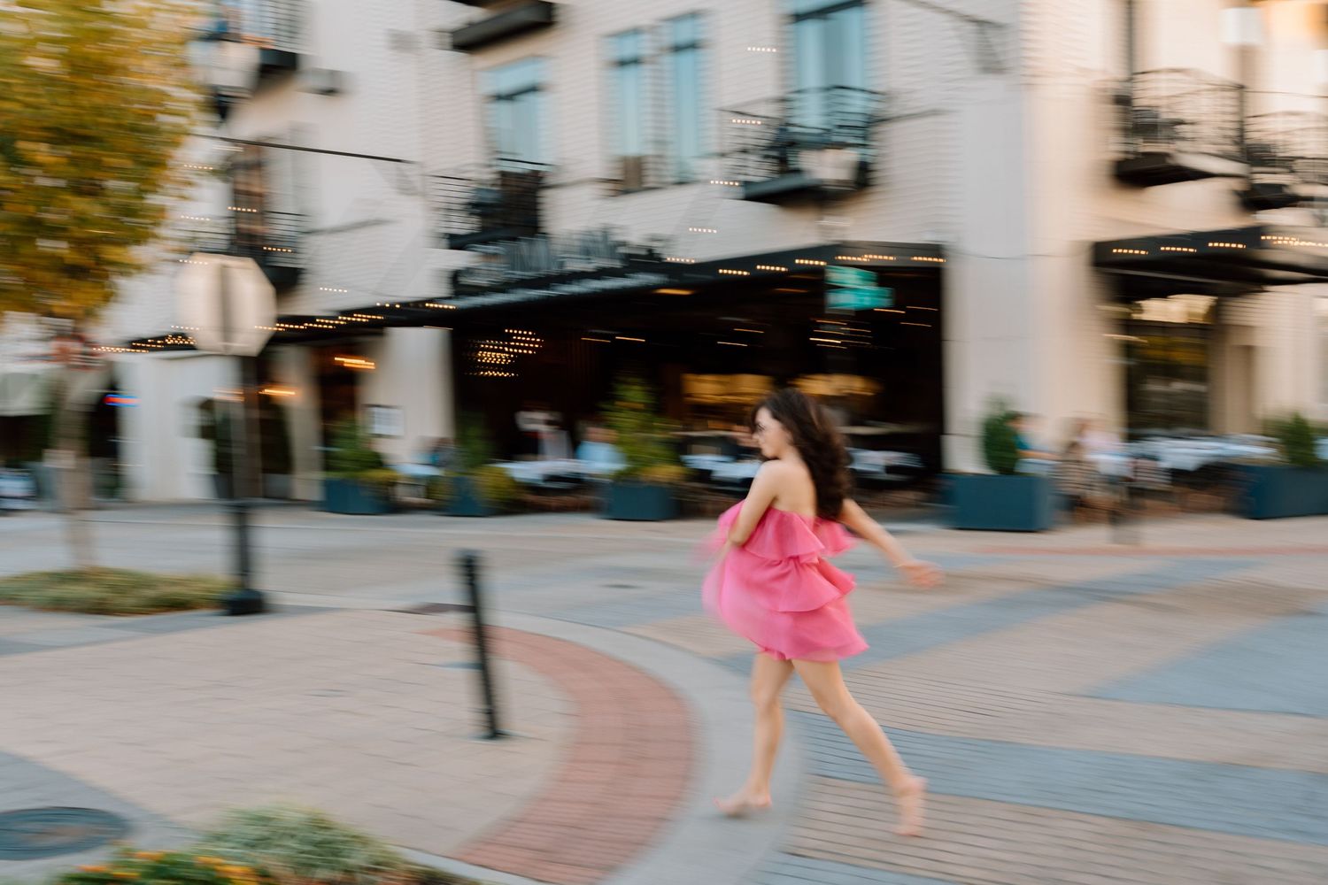 Energetic dance-like movements captured in sequence on an urban walkway. Chattanooga Senior Photographer