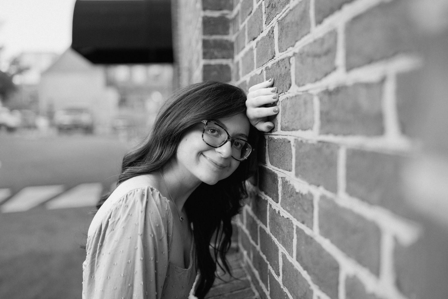 Black and white portraits against a textured brick wall. Chattanooga Senior Photographer