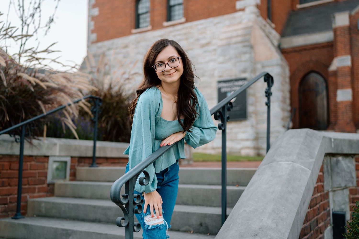 Dynamic movement shots in turquoise and denim against brick buildings. Chattanooga Senior Photographer