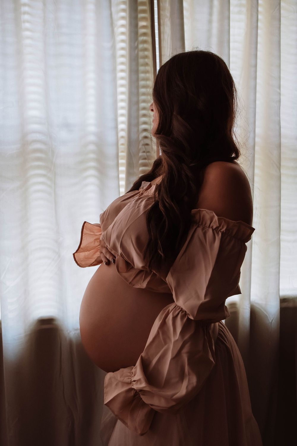Studio maternity photography focused on connection and emotion