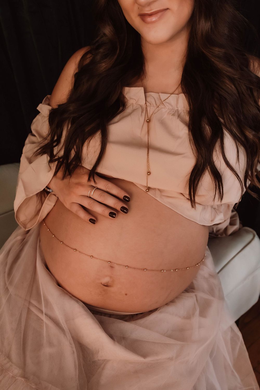 cinematic maternity portrait focused on emotion and quiet connection