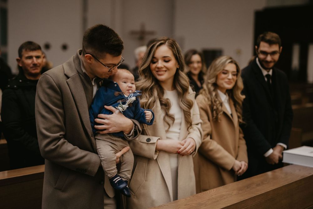 Group gathered in a church for a baptism ceremony.