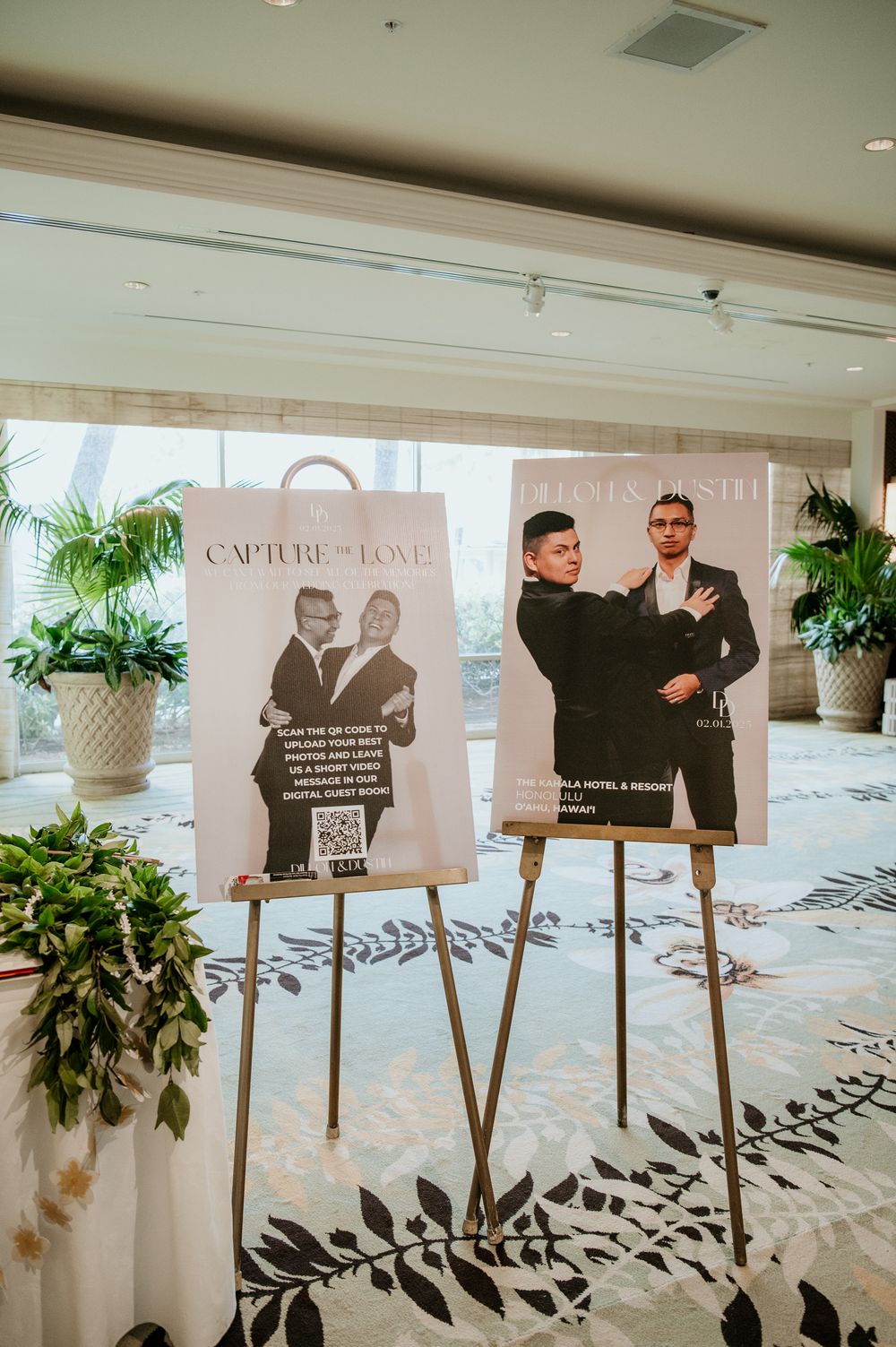 Two wedding-themed promotional posters displayed on easels in an elegant hotel lobby setting.