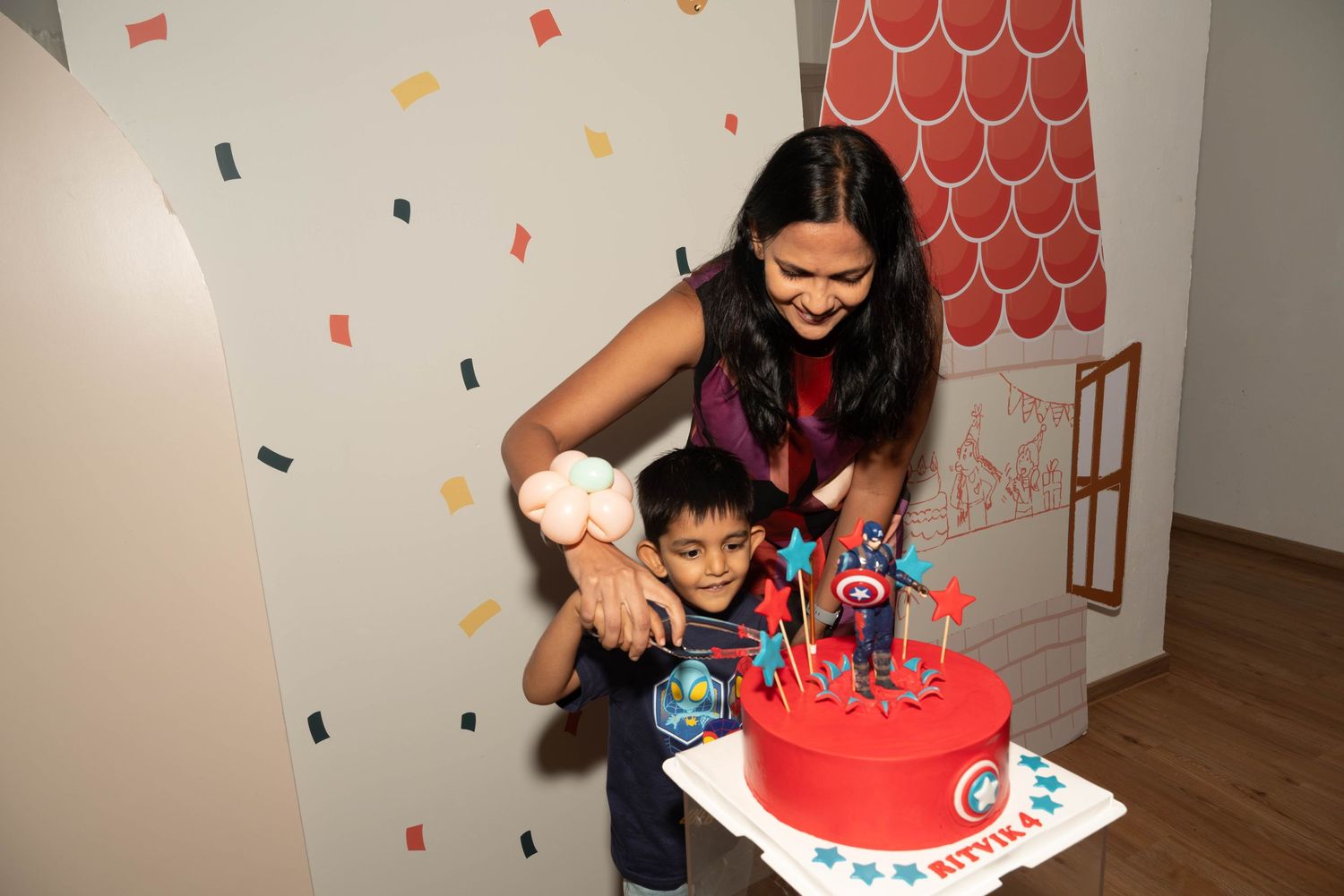 Birthday celebration moment with cake cutting at Impressions Kids Club.