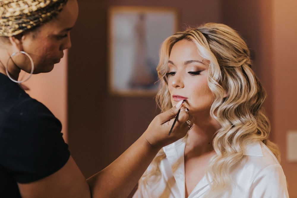Close-up shot of wedding day makeup application with soft natural lighting.