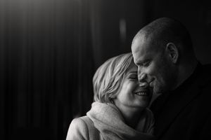 Intimate black and white portrait of a loving mature couple sharing a tender moment together.