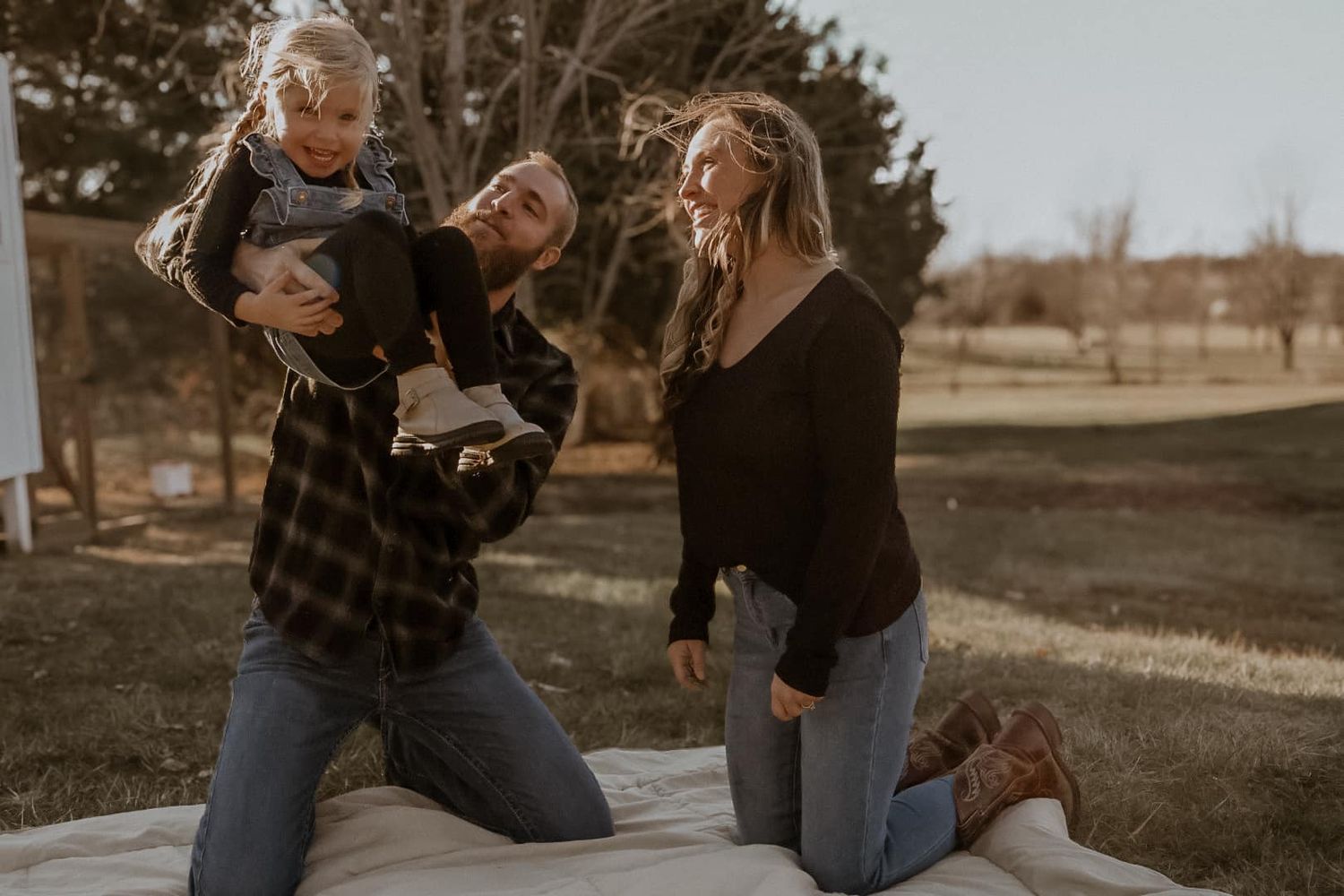 Friends enjoying time together outdoors in a casual setting during sunset.