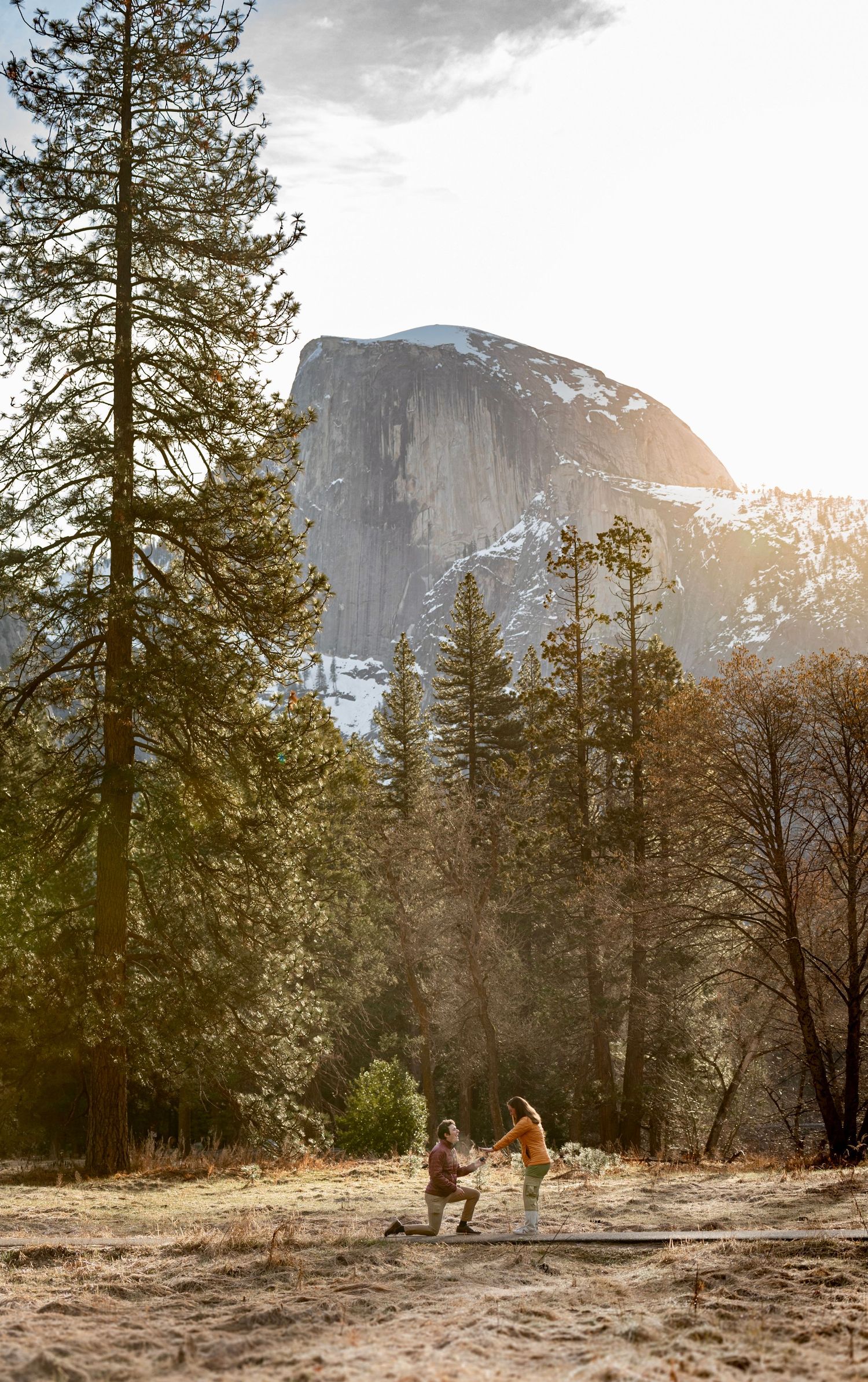A surprise engagement couple at Cook's Meadow, Yosemite at sunrise