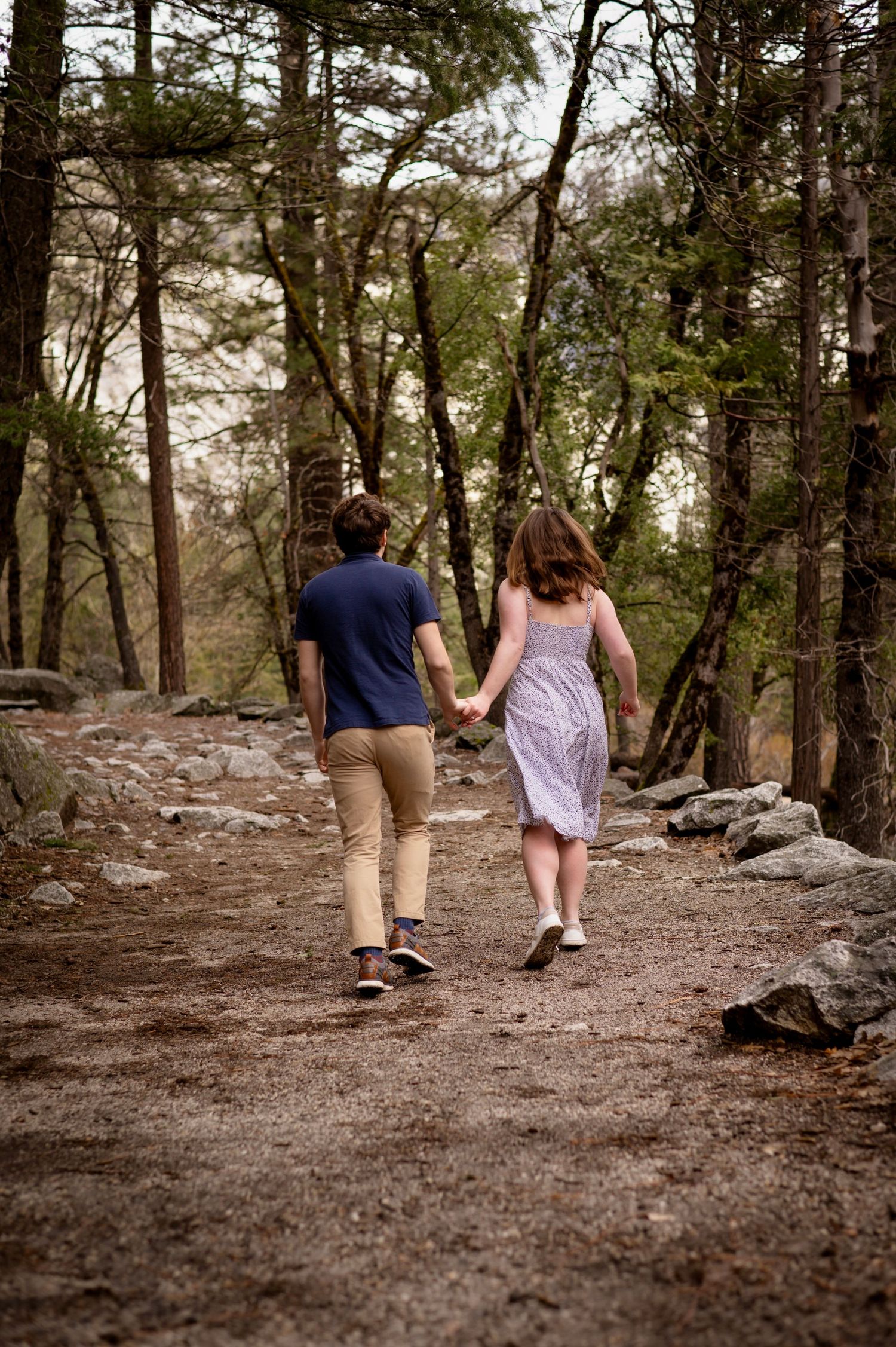 A couple running along the trail at Mirror Lake, Yosemite