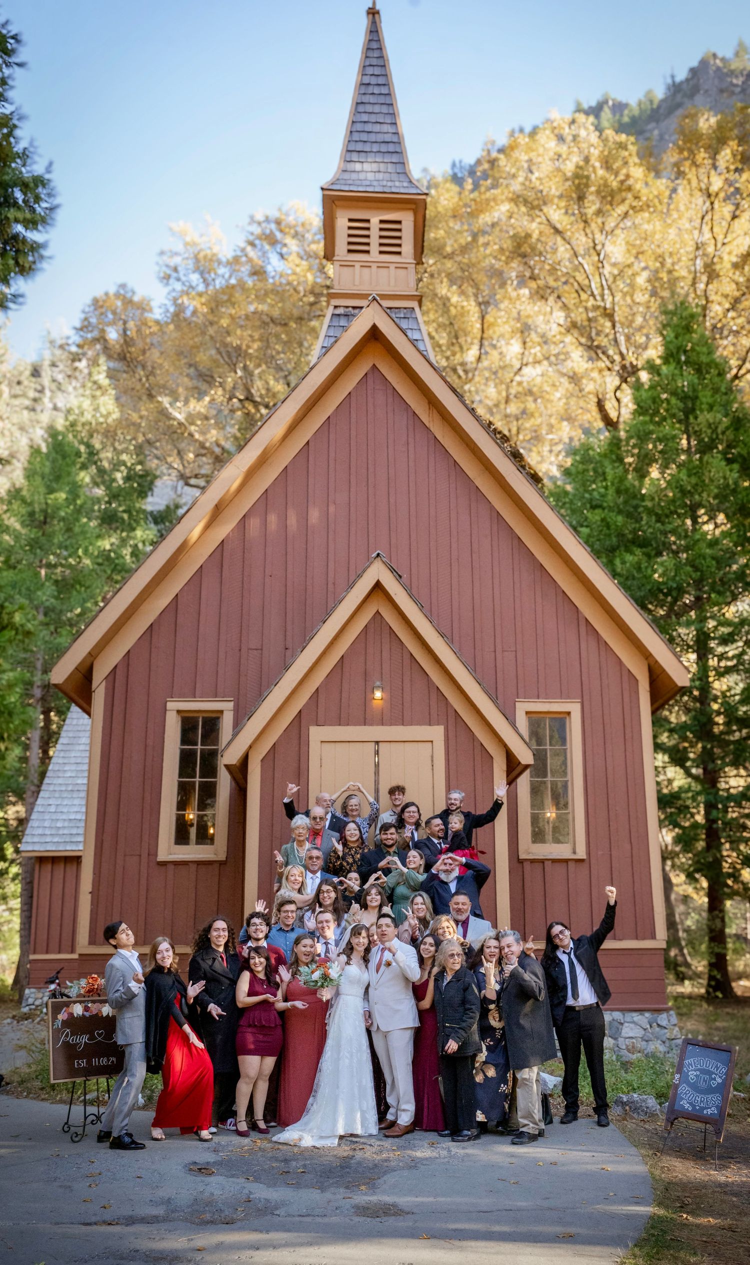 A large family photo in front of Yosemite Chapel