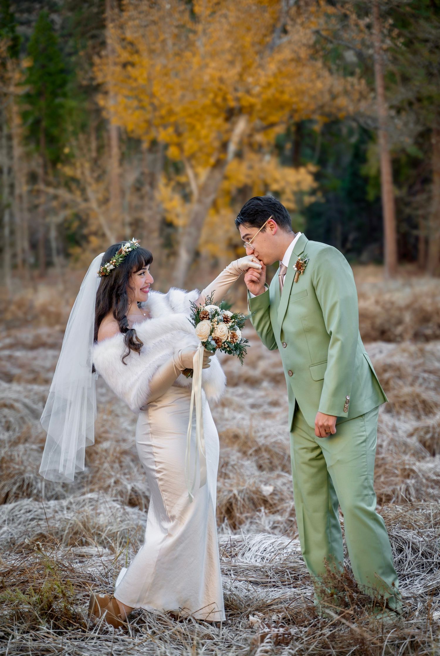 A bride getting her hand kissed by her groom Yosemite