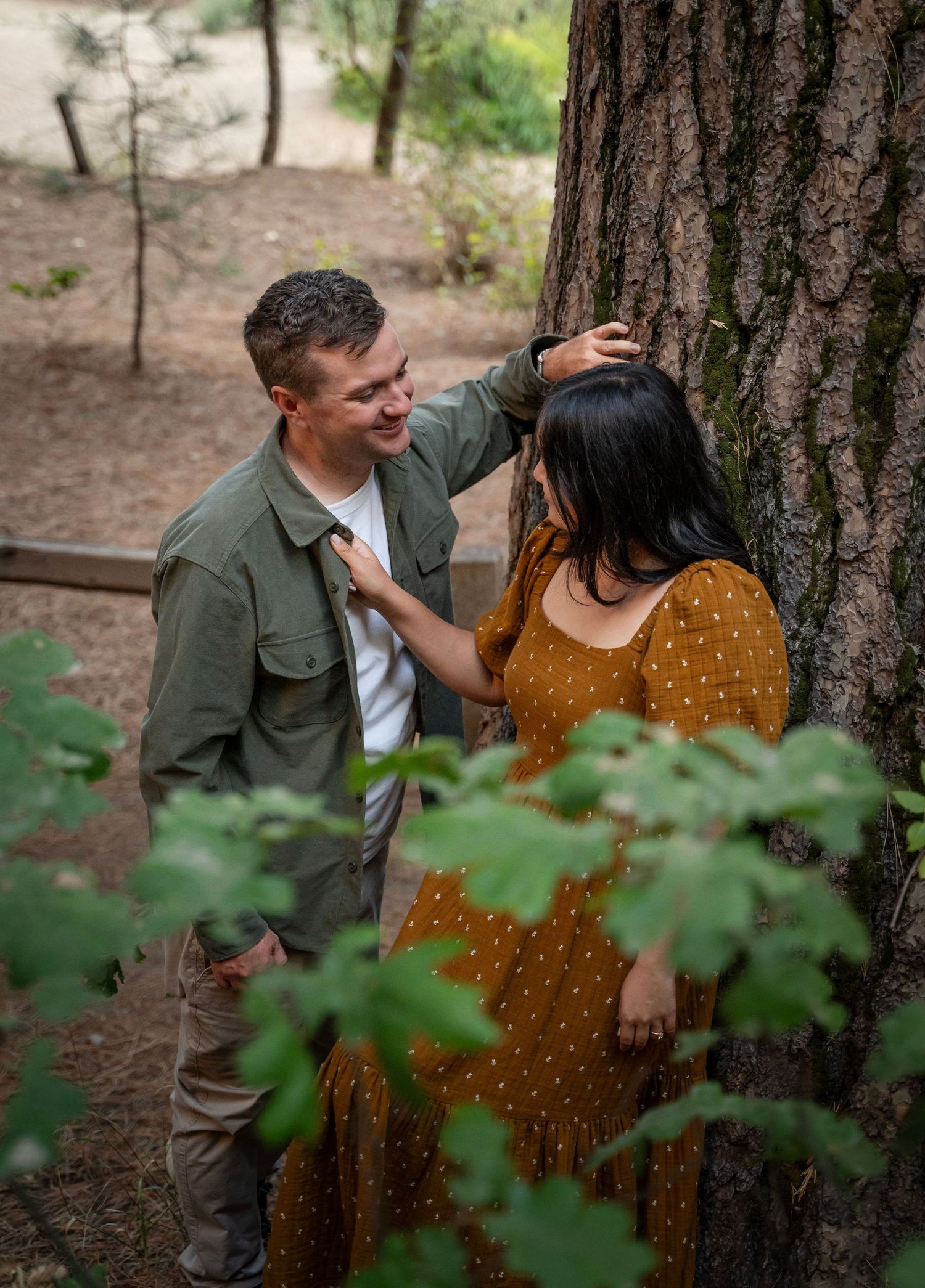 a newly engaged couple meet by the river in Yosemite, California