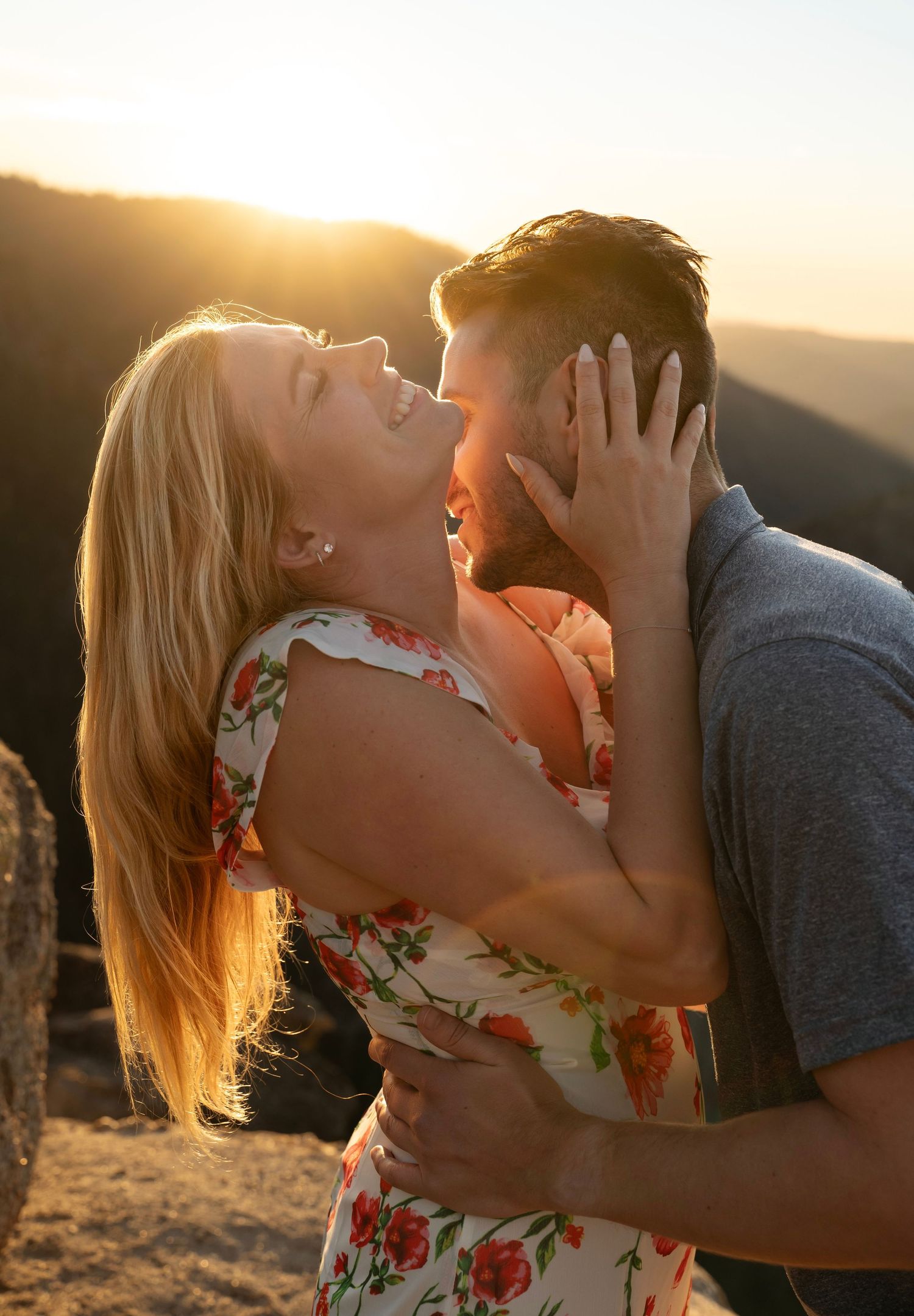 A warm lighting sunset laughter hug at Taft Point, Yosemite, California
