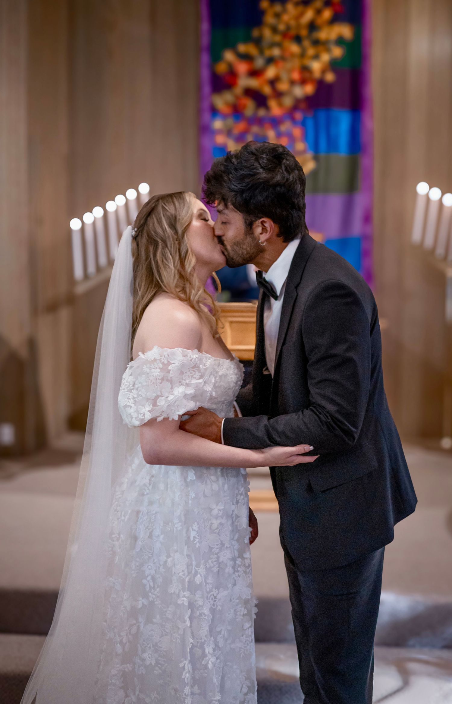 A beautiful bride and groom kissing at their wedding at Yosemite Chapel