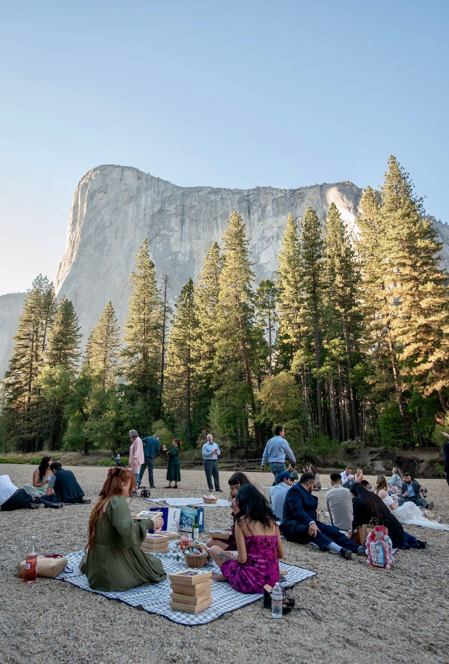 A beautiful bride and groom walking the aisle at their wedding reception at Cathedral Beach, Yosemite