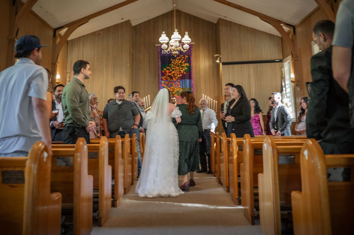 A beautiful bride and groom walking the aisle at their wedding at Yosemite Chapel
