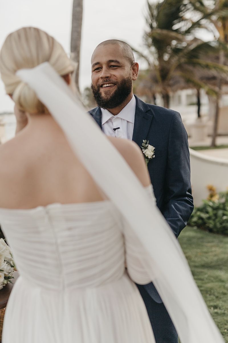 Bride and groom first look by the ocean at Villa la Joya Riviera Maya elopement photographer.