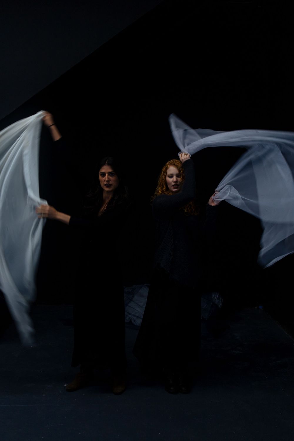 No Name Collective, Macbeth Theatre production promo photography. Dark, low lit moody image of Annaliese Kirby and Maggie Hood.