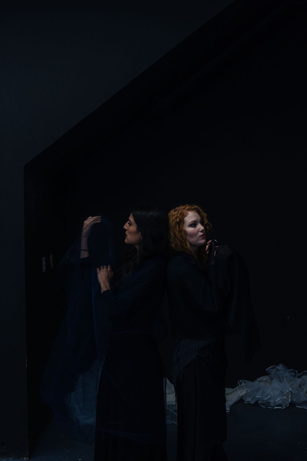 No Name Collective, Macbeth Theatre production promo photography. Dark, low lit moody image of Annaliese Kirby and Maggie Hood.