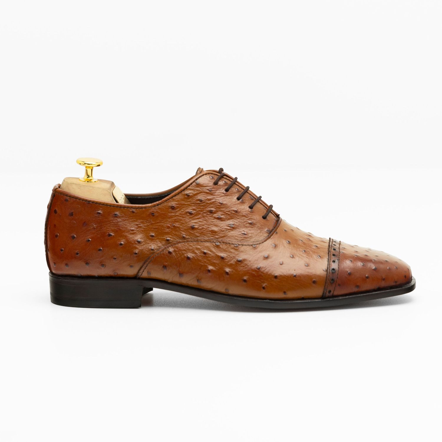 Brown ostrich leather oxford dress shoe shown from different angles displaying its distinctive textured pattern and lacing.