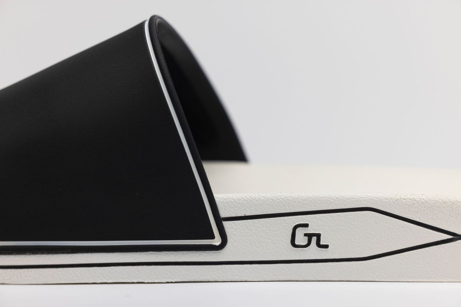 Close-up view of sleek black and white minimalist geometric shapes creating an abstract pattern.