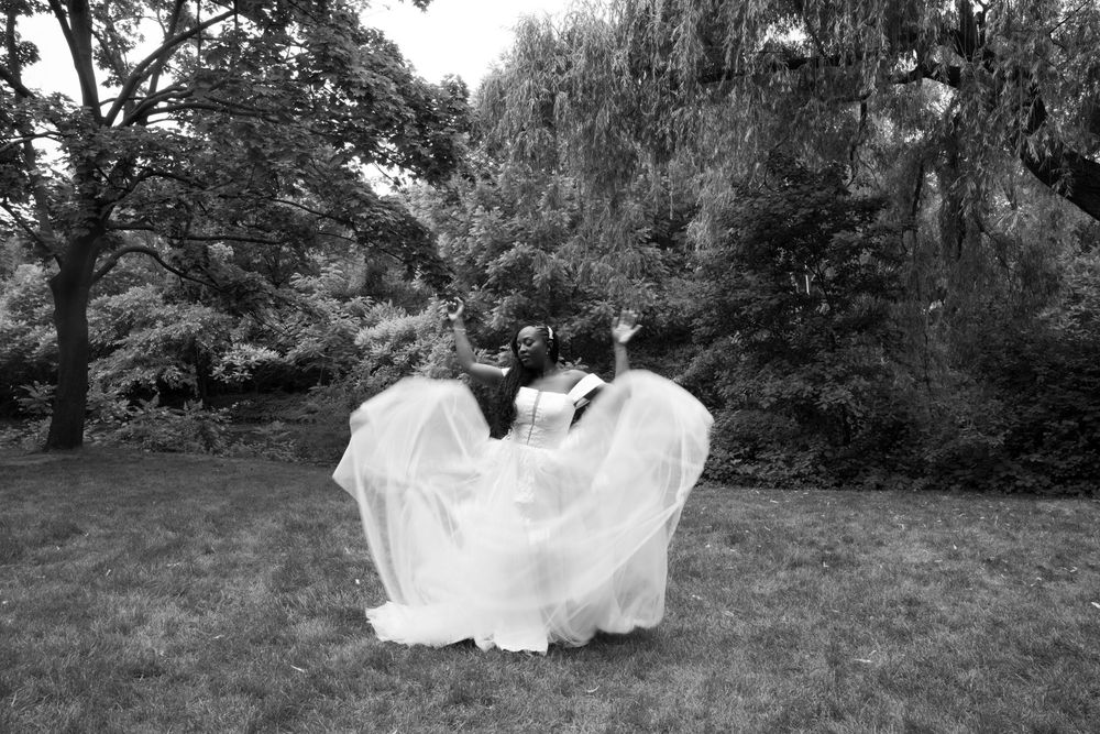 A flowing white wedding dress moves gracefully across a lush green lawn in a series of artistic motion photographs.