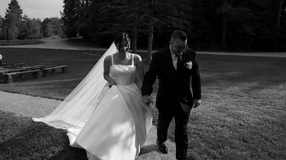 A black and white wedding photo montage shows romantic outdoor scenes with trees and flowing white dresses.