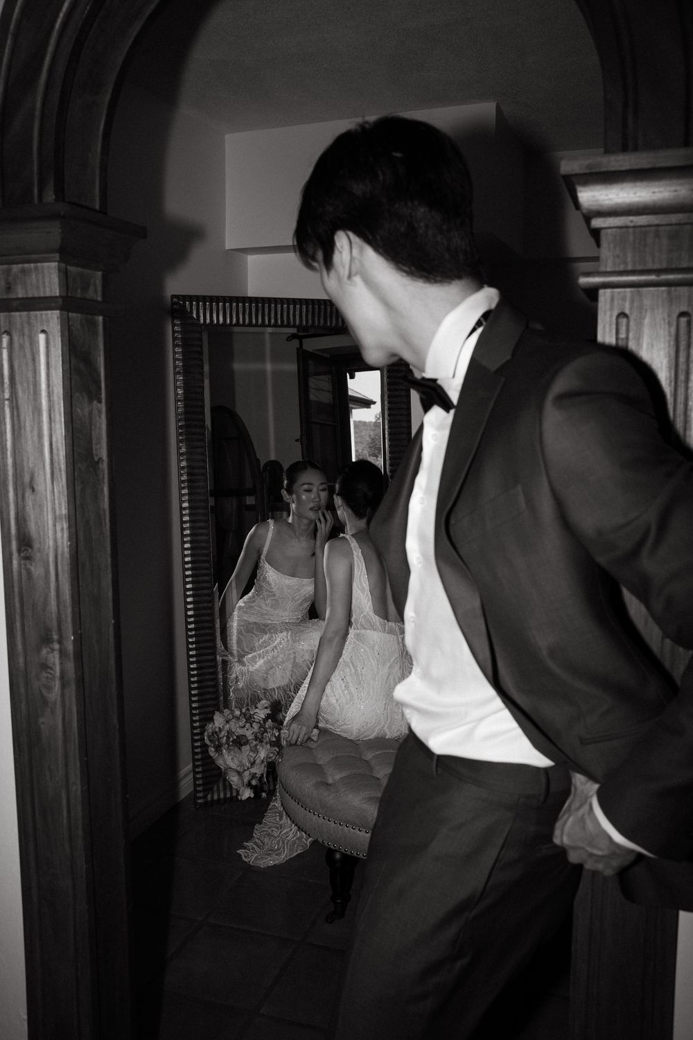 A black and white photo series shows a couple dancing in an intimate moment at what appears to be a wedding reception.