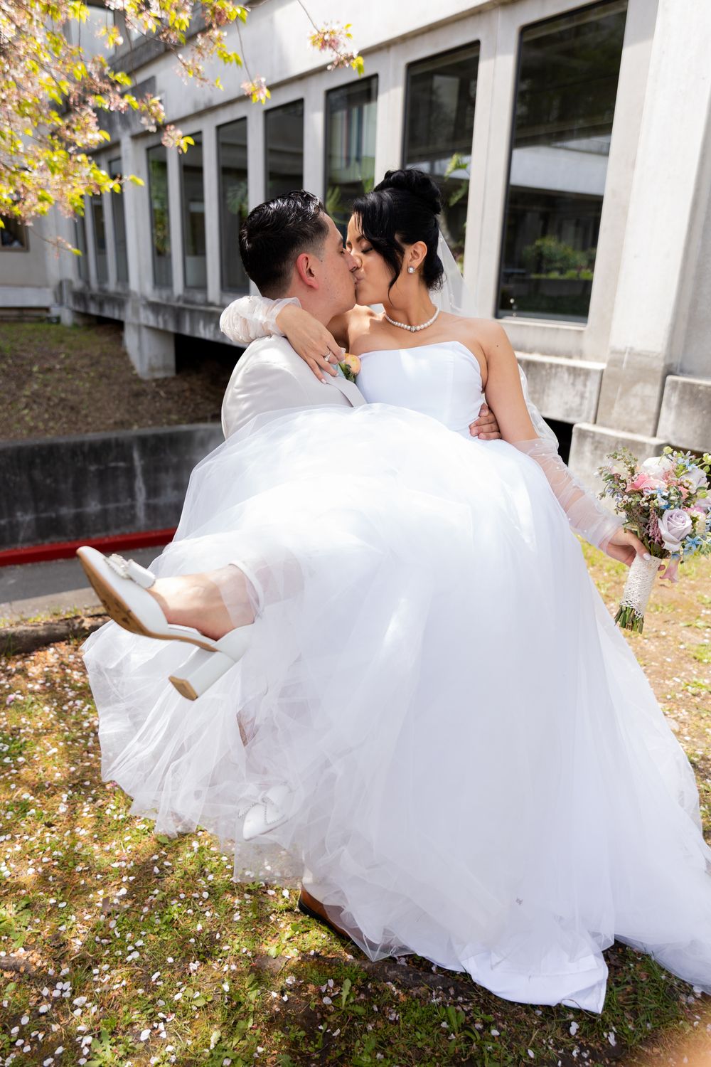 A romantic wedding photo sequence showing a couple in white attire embracing outdoors with autumn foliage in the background.