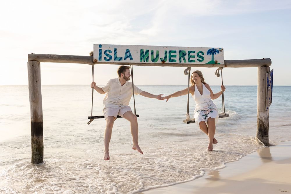 A set of five wedding photos showing legs and feet of a bride and groom posing on a sandy tropical beach near water.
