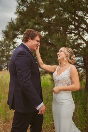 An intimate wedding moment captured as the couple reacts emotionally during their first look.