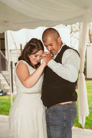 A romantic wedding photo sequence shows a couple dancing and embracing under a white tent during their celebration.