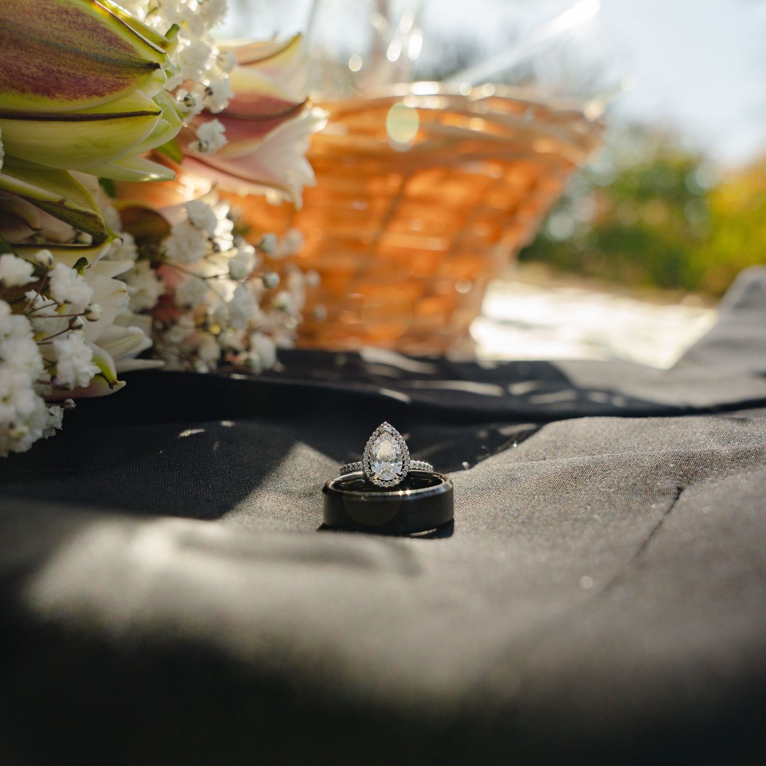 Artful composition of baby's breath flowers and ultrasound photos in soft natural lighting.