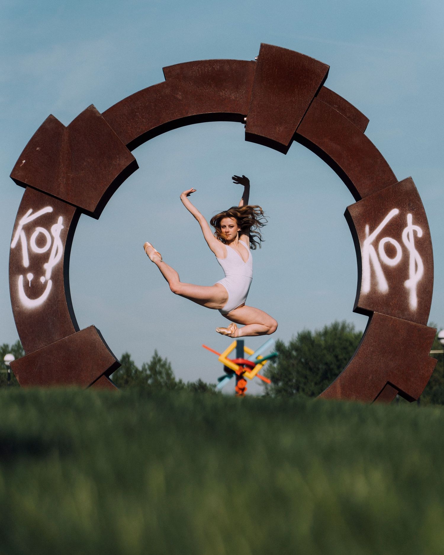 Graceful ballet photography moment with a flexible dancer arching into a pose at White River State Park Indy Dance Photographer