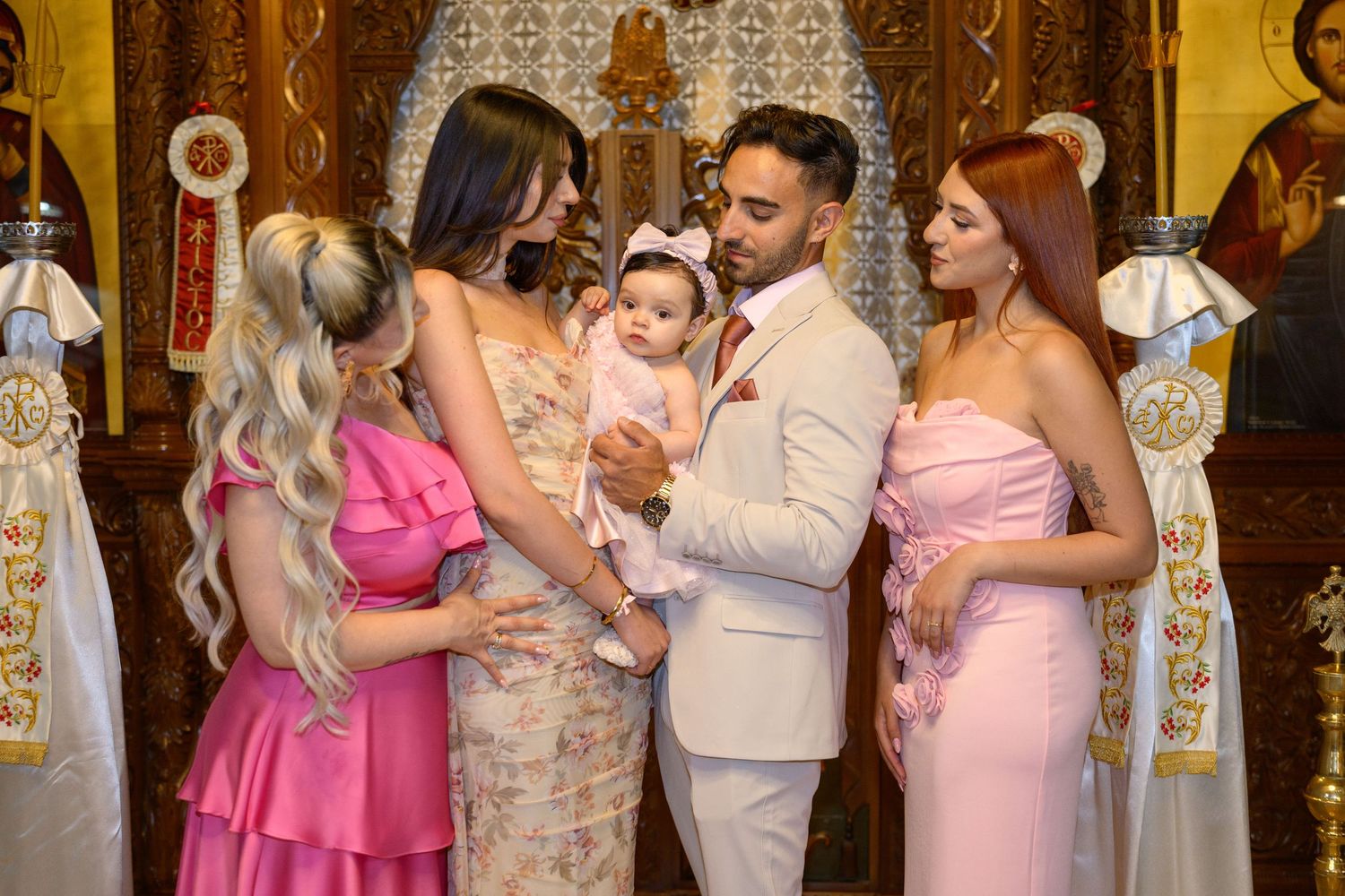 A group gathered in formal attire for a special religious ceremony in a church setting.