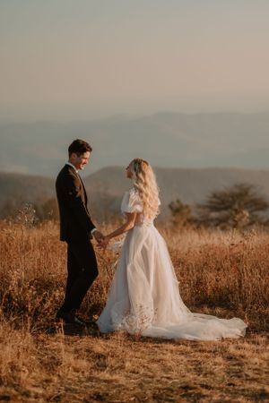 Andrew turns around to see his bride, Alissa, in her elegant white wedding dress.