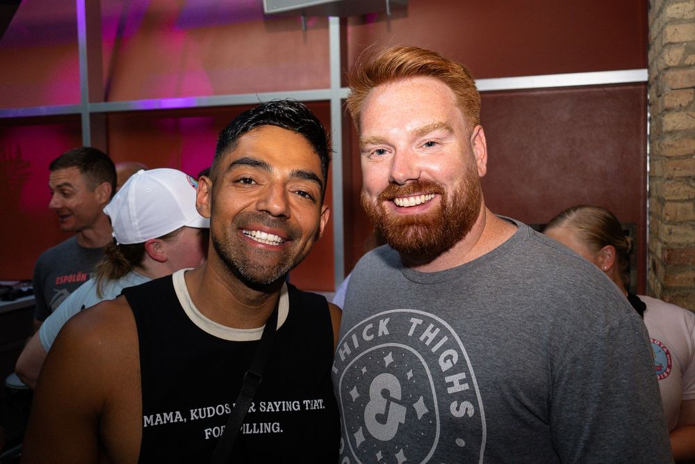 Danial Ruiz and Mike O'Brien pose together at the Opening Party of Pride Bowl hosted at Sidetrack in boystown Chicago