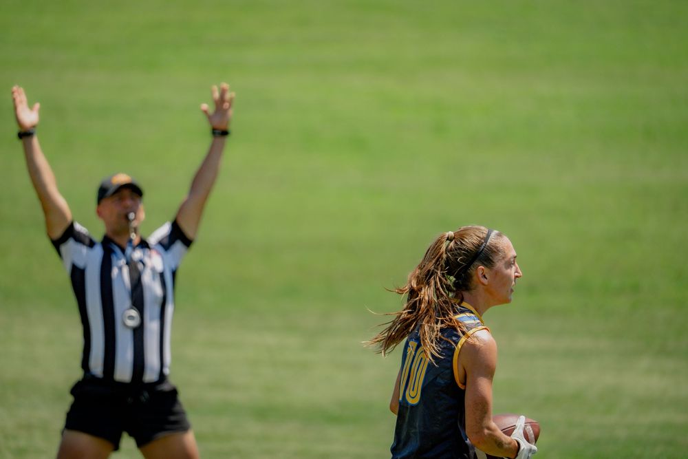 A referee indicates a touchdown after a player from the LA Icons scores at Pride Bowl hosted by the National Gay Flag Football League