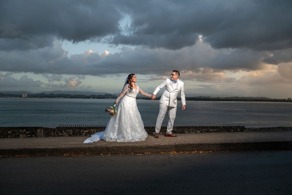 Artistic panorama series of beach wedding photos with dramatic stormy clouds at sunset over the ocean.